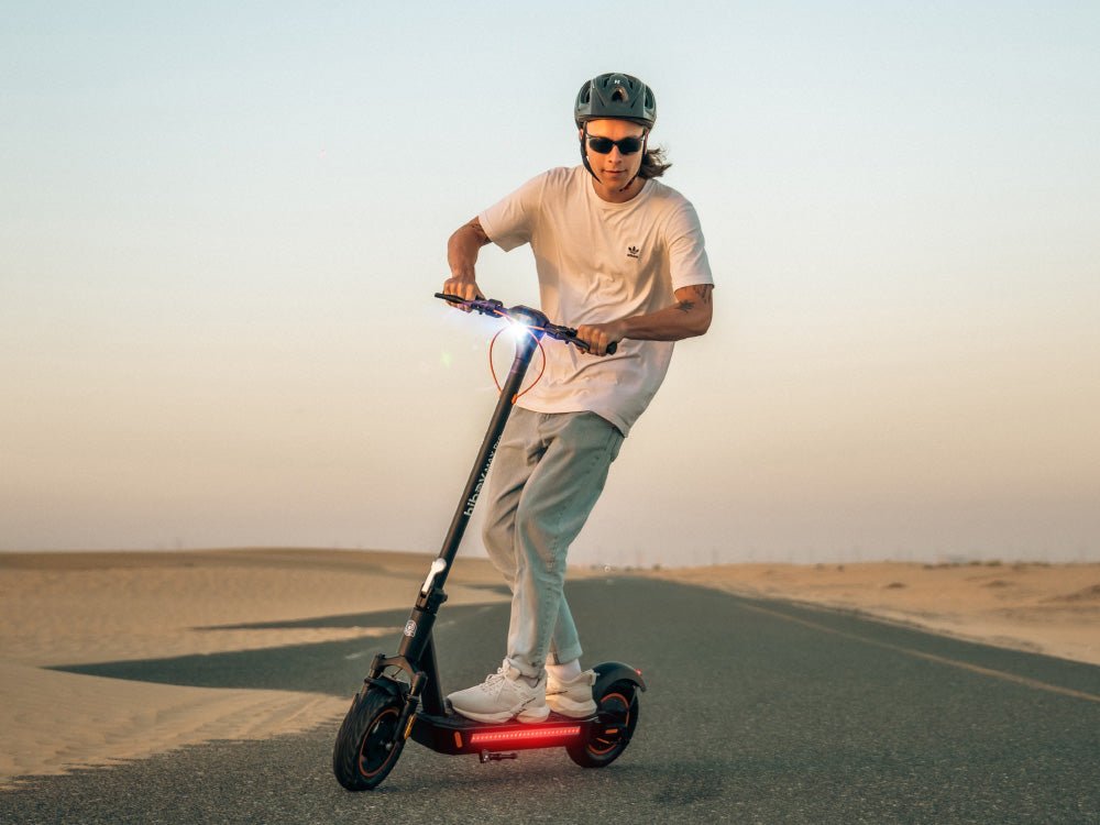 Rider on a Hiboy MAX Pro electric scooter on an open desert road