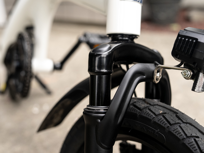 Close view of the telescopic front suspension fork and headlight on the Hiboy C1 folding electric bike