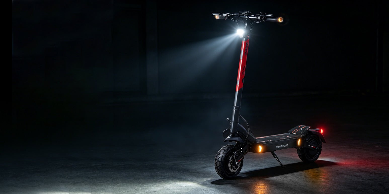 Nanrobot G2 at night with headlight, turn signals and tail light lit