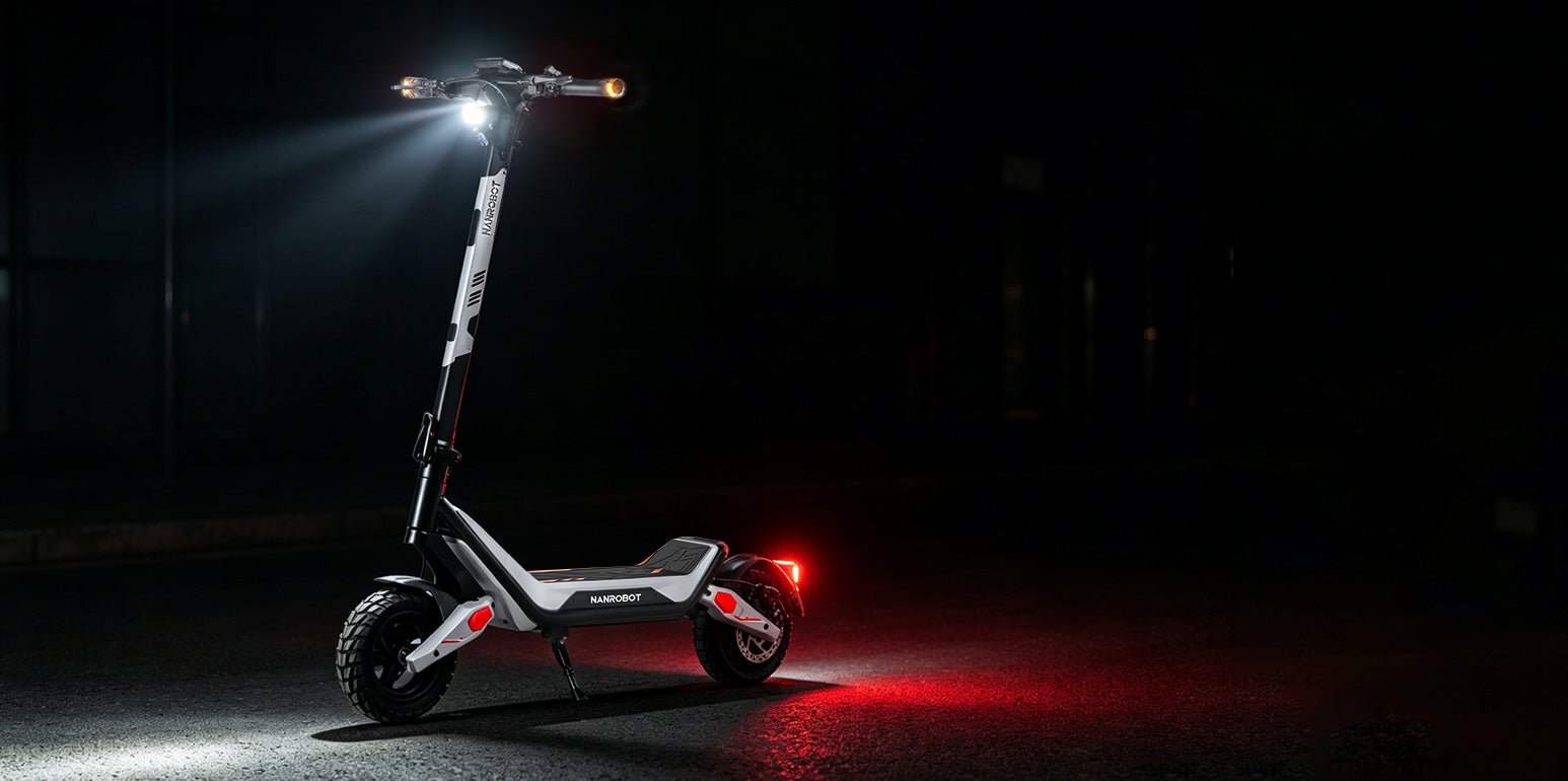 Nanrobot G3 at night with headlight beam and red tail light lit
