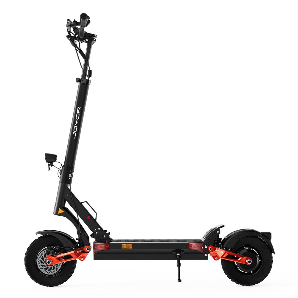 Side profile of the Joyor T10 off-road electric scooter with orange swingarms and block-tread tires
