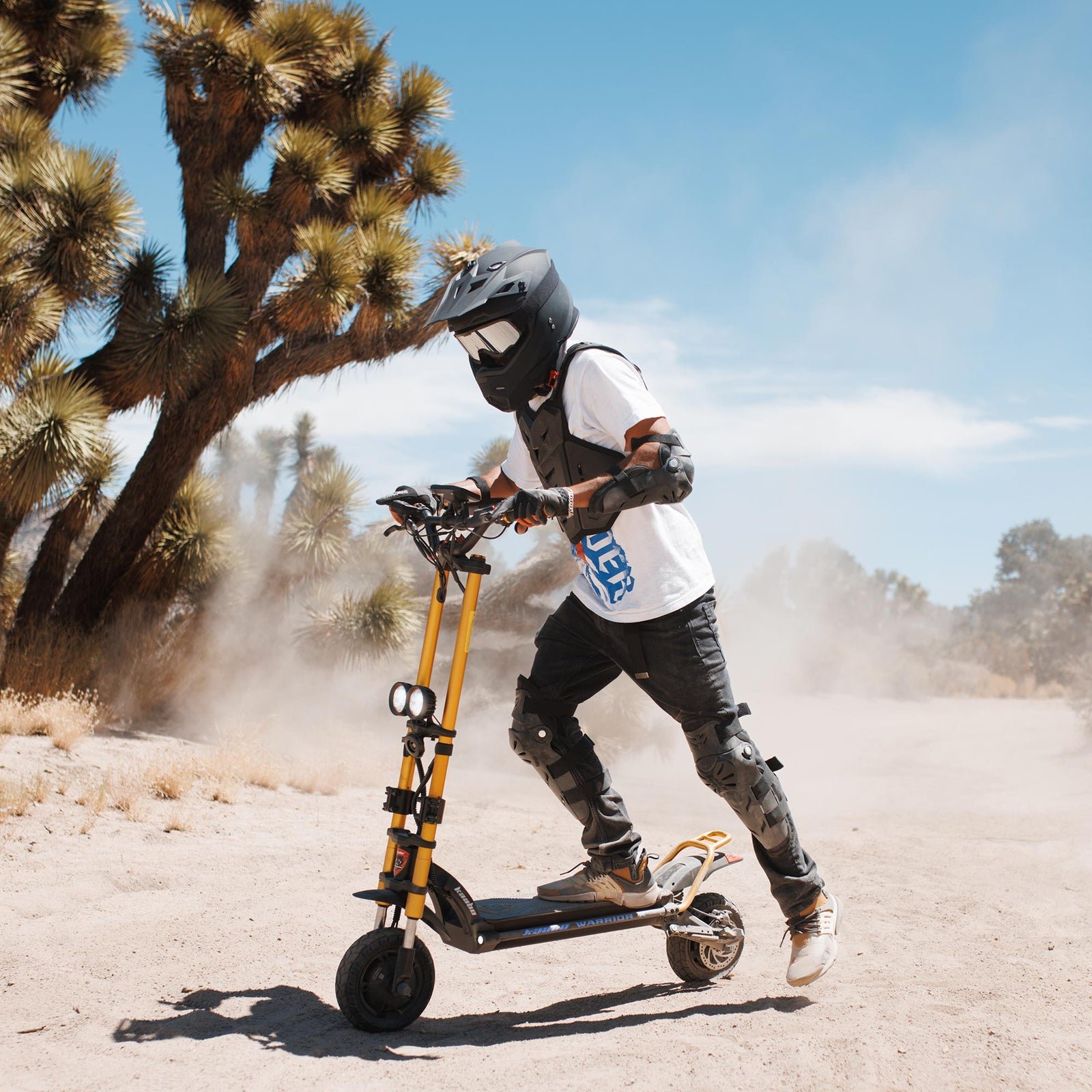 Rider taking the Kaabo Warrior X Max across off-road terrain