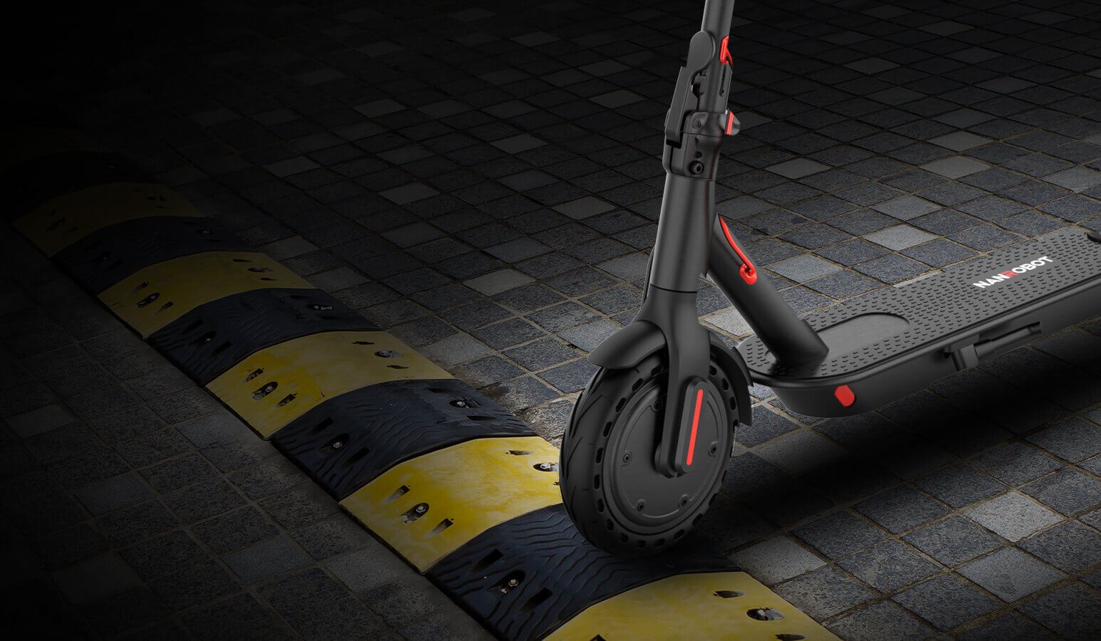 Nanrobot H1 solid front tire rolling over a speed bump