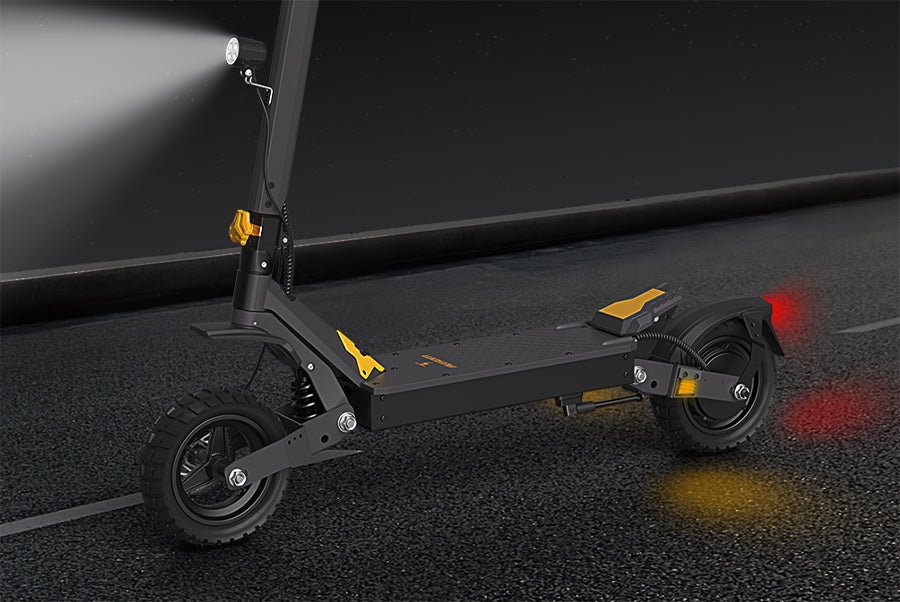 Ausom L1 electric scooter at night showing its headlight beam, taillight glow and side reflectors