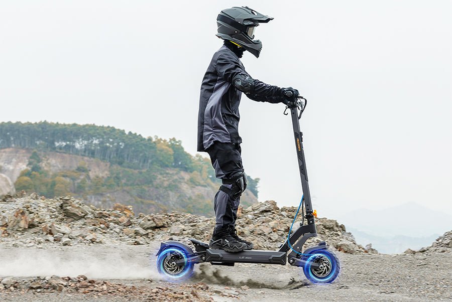 Rider descending a rocky slope on the Ausom L2 Max dual motor e-scooter under braking