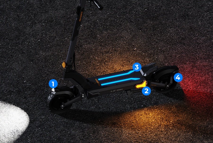 Ausom L2 Max dual motor e-scooter seen from above at night with headlight, ambient deck lights, turn signal and taillight glowing