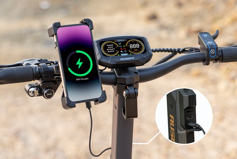 Phone mounted on the Ausom L2 Max dual motor e-scooter handlebar charging from the built-in USB port