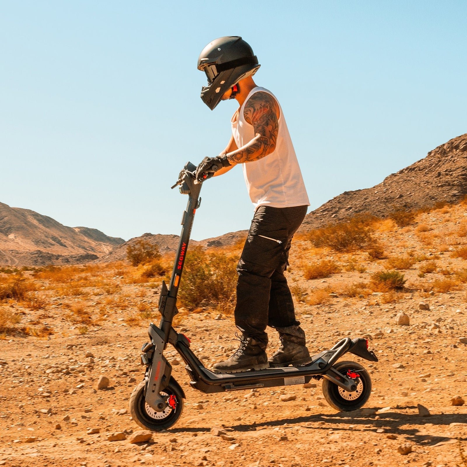 Rider on a Segway GT3 SuperScooter on a dirt track in open desert country