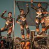 INMOTION P6 riders on a race podium beside their unicycles