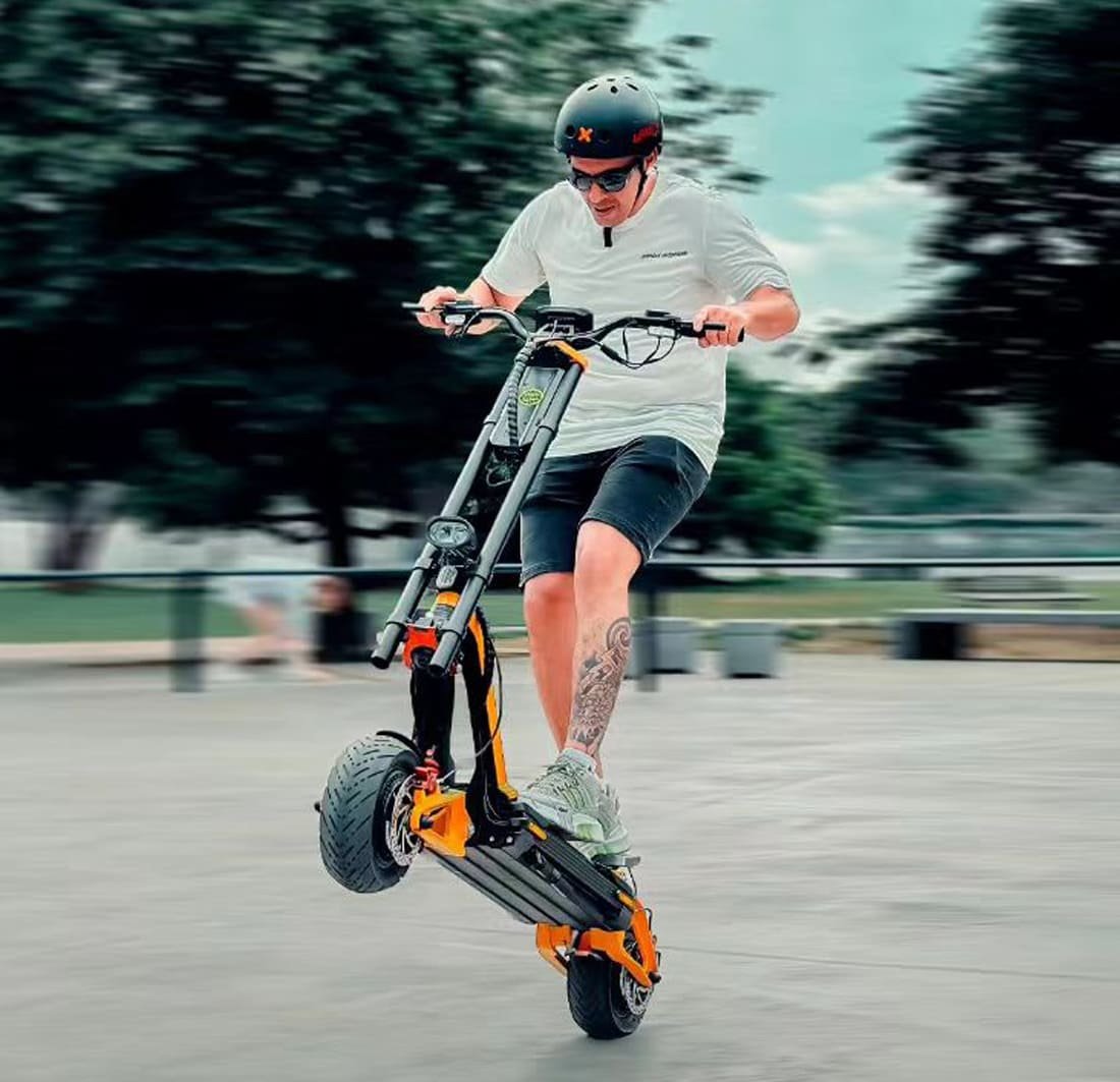 Rider on an INMOTION RS electric scooter in a skate park in daylight