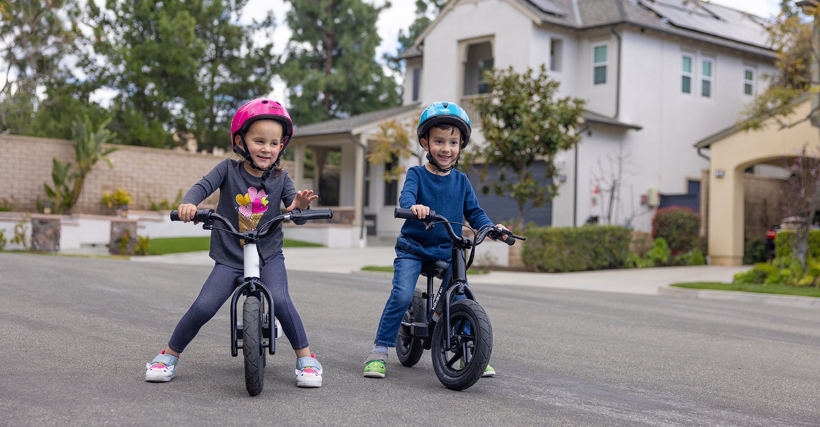 Child riding the Hiboy BK1 electric balance bike with anti-slip grips and footrests