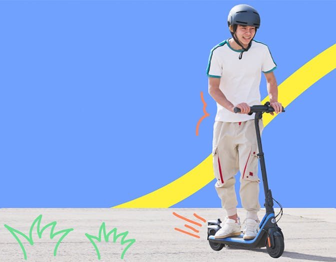 Child kick-starting the Segway Ninebot C2 Pro