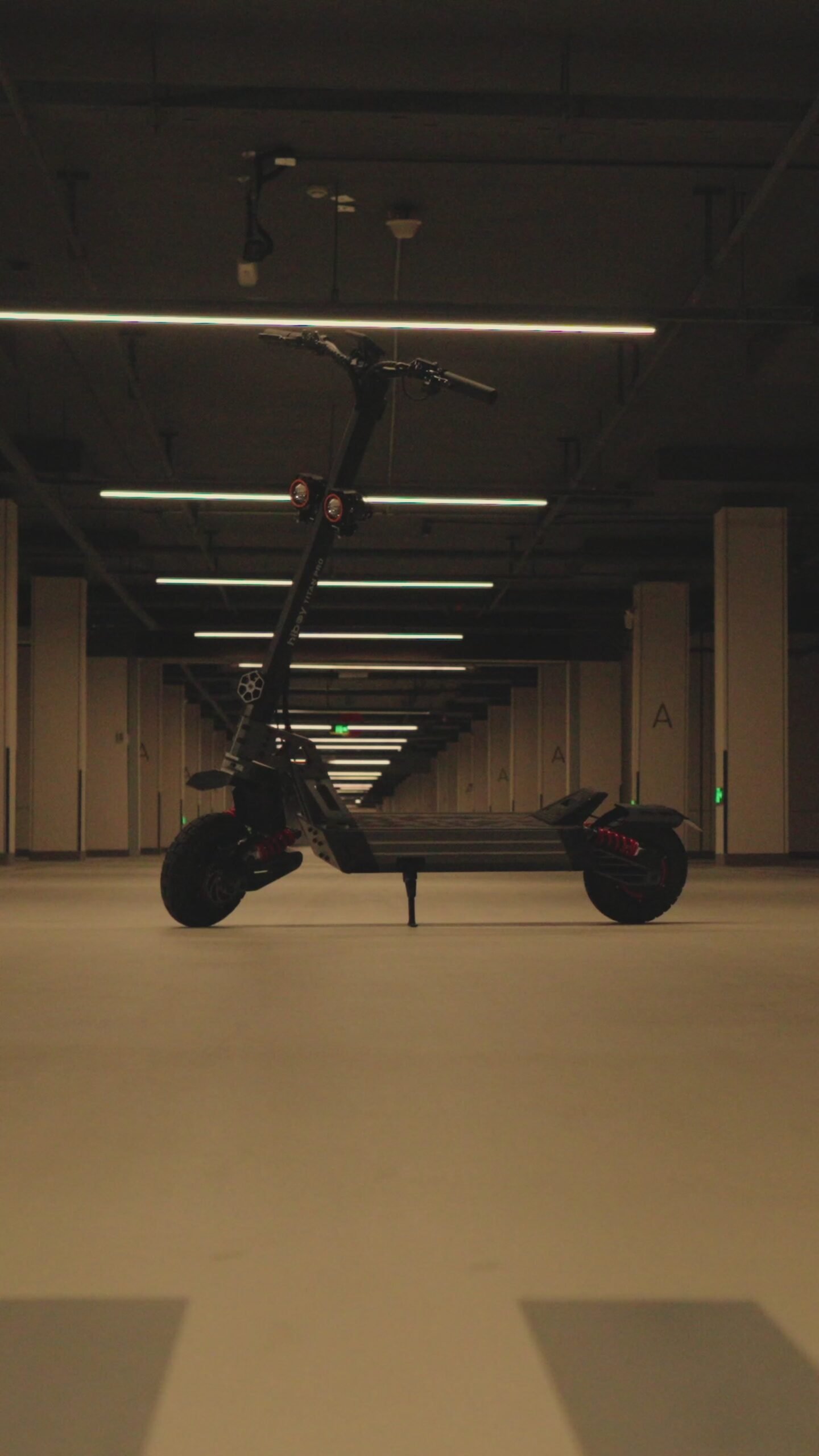 Hiboy TITAN PRO dual-motor electric scooter standing in an empty underground garage