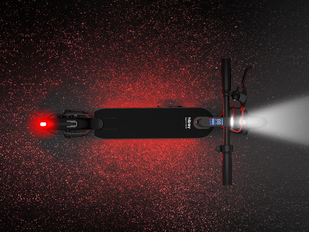 Hiboy S2 Nova electric scooter at night with headlight, taillight and ambient deck lighting on