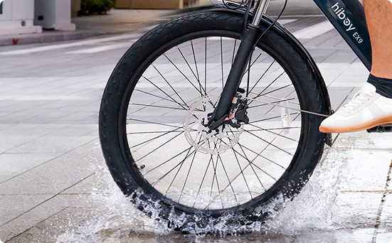 Hiboy EX9 electric bike front wheel riding through water