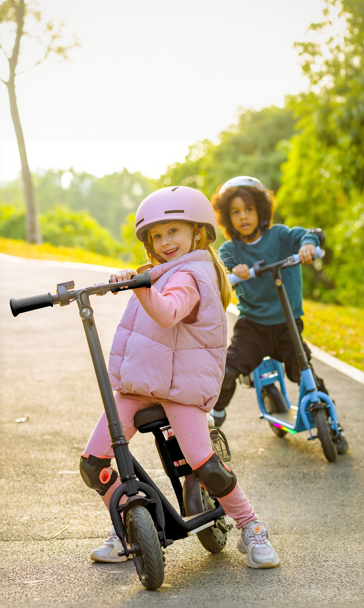 Child in a pink helmet seated on a pink Hiboy Q2 Lite kids electric scooter