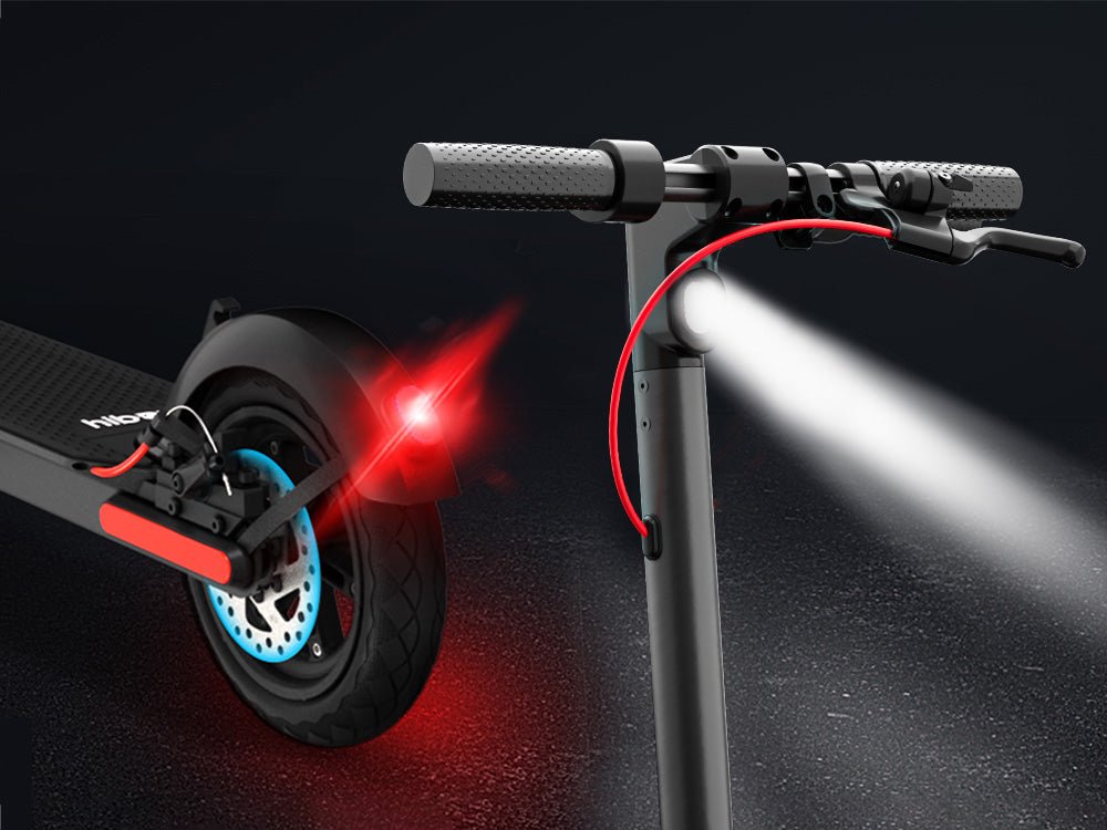 Headlight beam and rear brake light of the Hiboy S2R Plus electric scooter at night