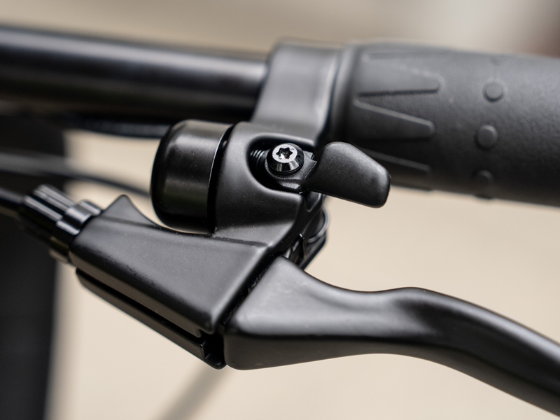Bell and brake lever on the handlebar of the Hiboy C1 folding electric bike