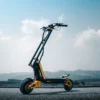 INMOTION RS electric scooter in profile on open road with mountains behind