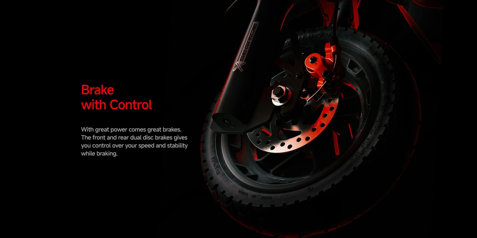 Front disc brake with red caliper on the Segway ZT3 Pro electric scooter