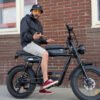 Riding’times GT33 cargo electric bike rider outside a brick building