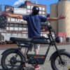 Riding’times GT33 cargo electric bike rider beside industrial silos