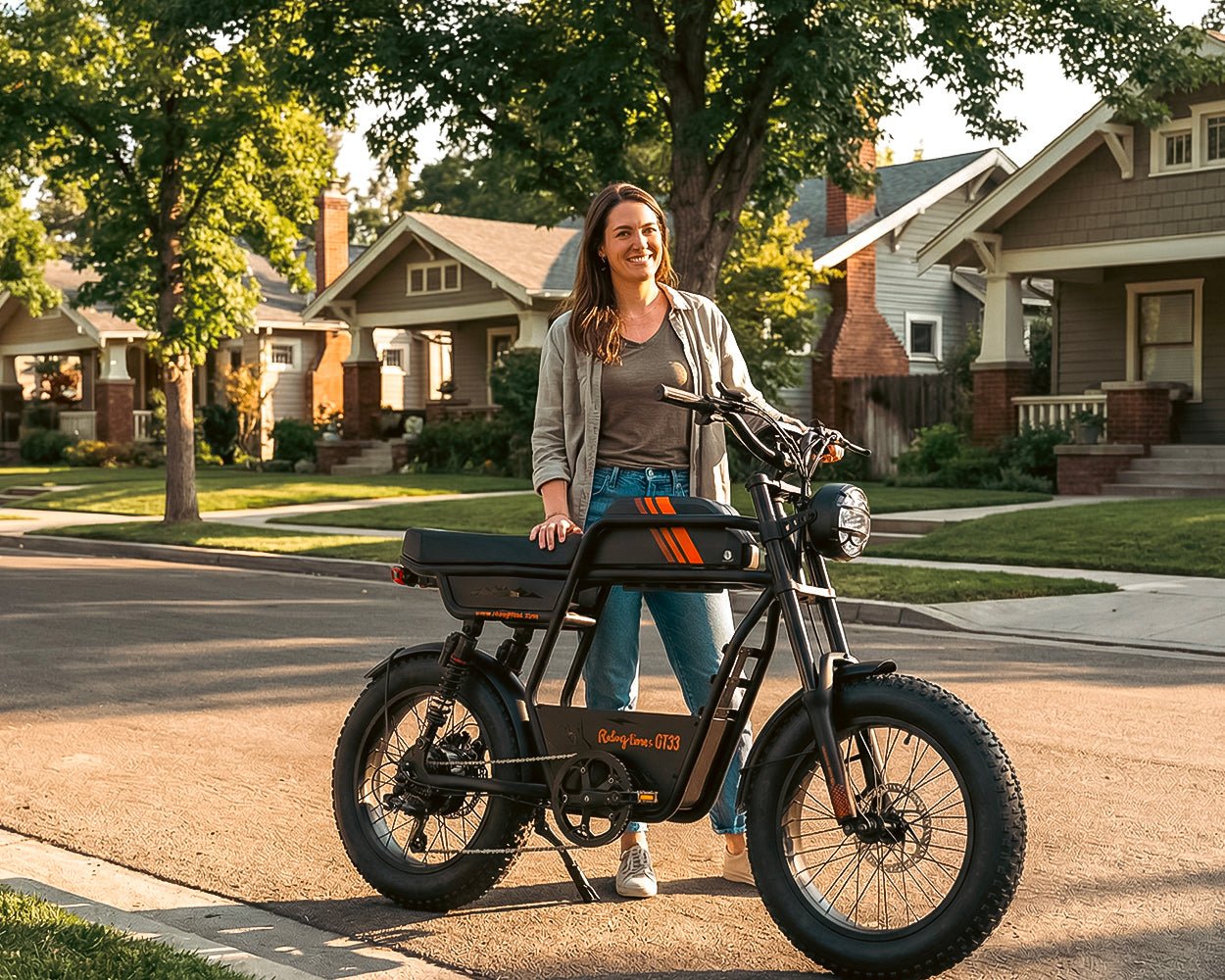 Rider walking the Riding’times GT33 cargo electric bike on a suburban street