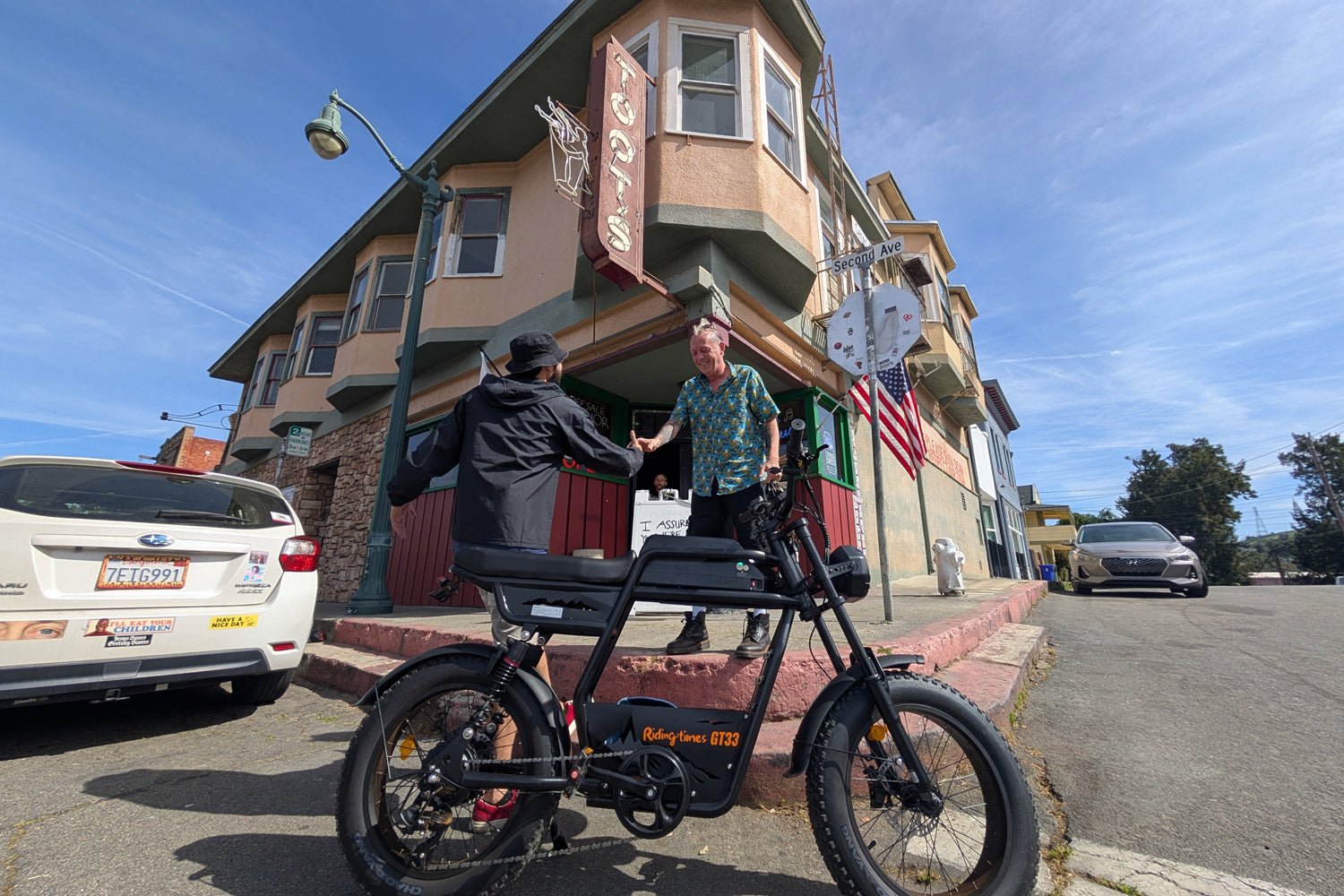 Riding’times GT33 cargo electric bike rider at a suburban intersection