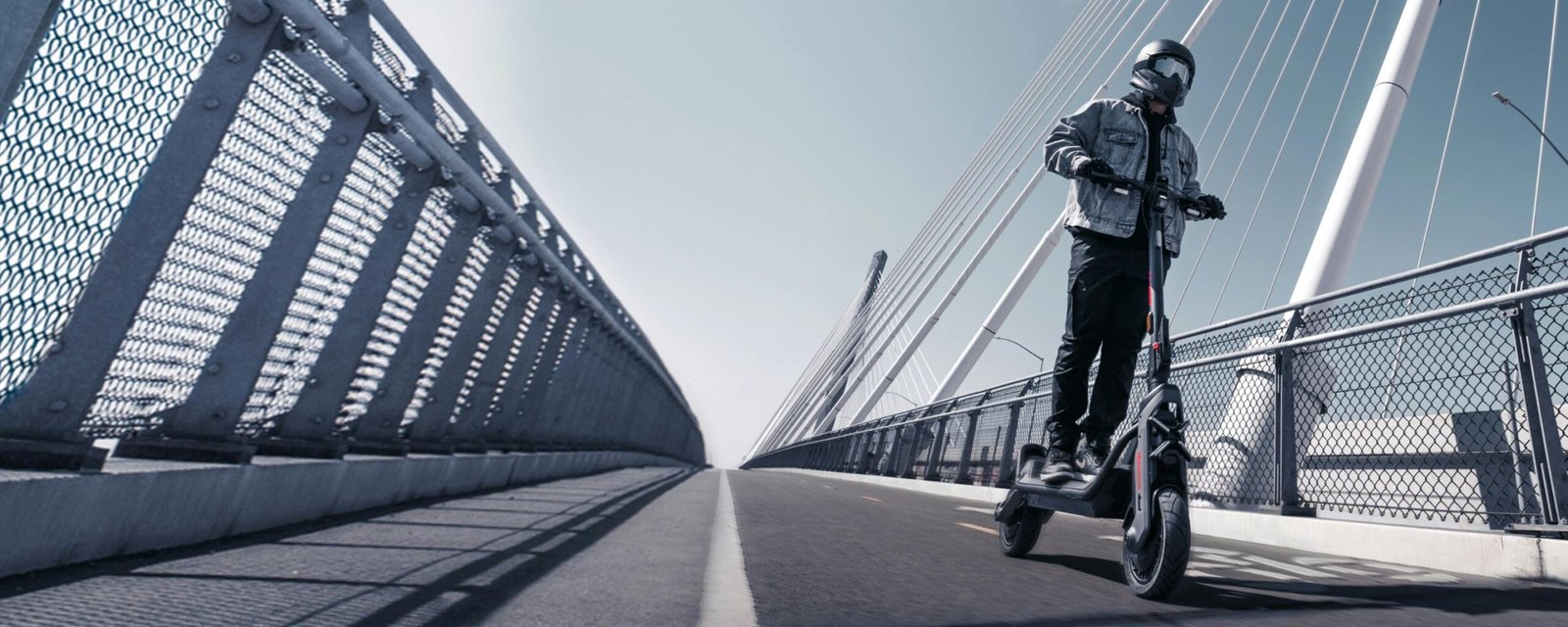 Rider crossing a bridge on the Segway GT3 SuperScooter