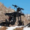Riding’times GT electric motorbike fitted with the snow track kit parked on a snowy ridge