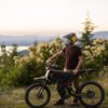 Riding’times GT73 Pro electric motorbike at a coastal lookout at sunset