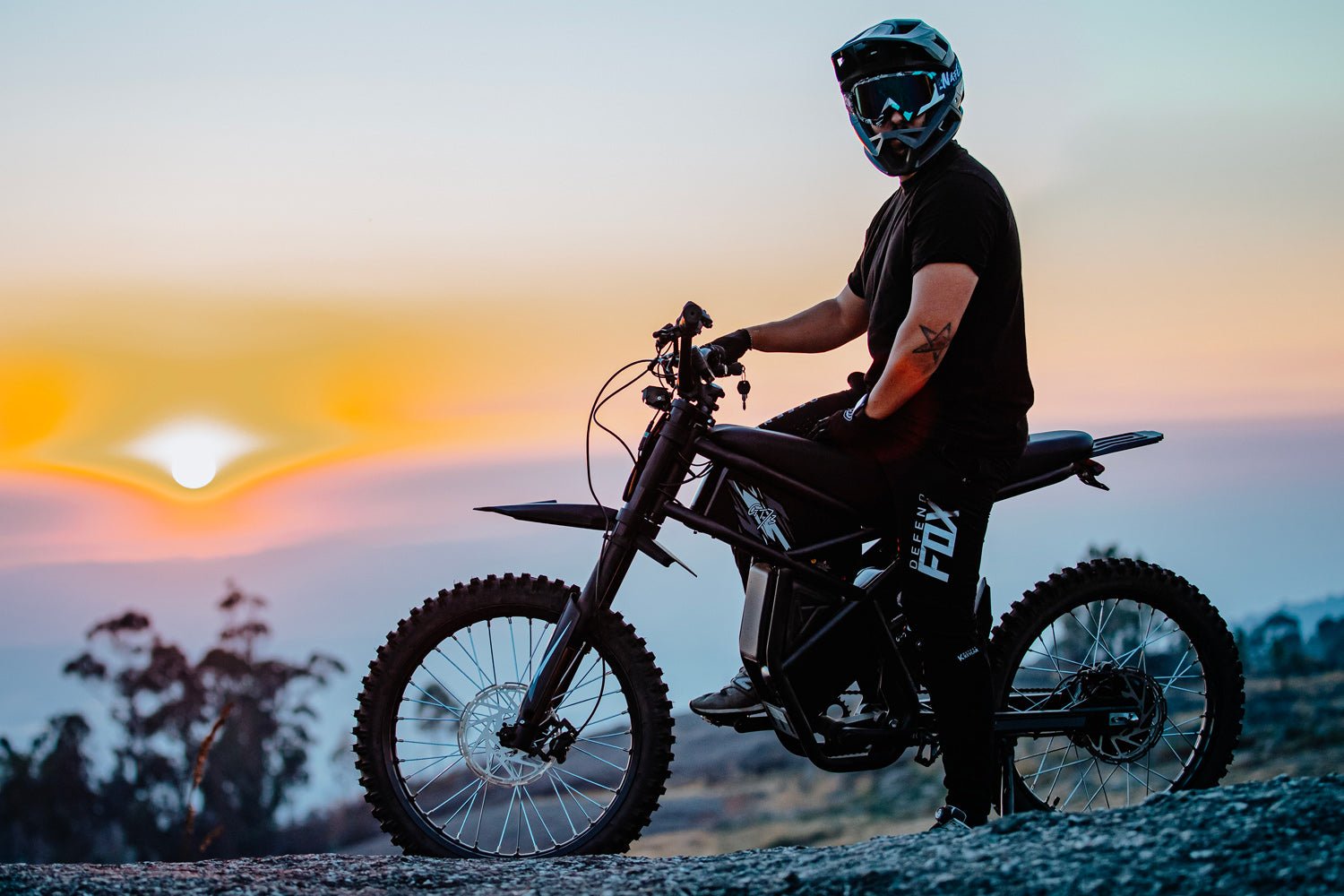 Rider on the Riding’times GT73 electric motorbike at sunset