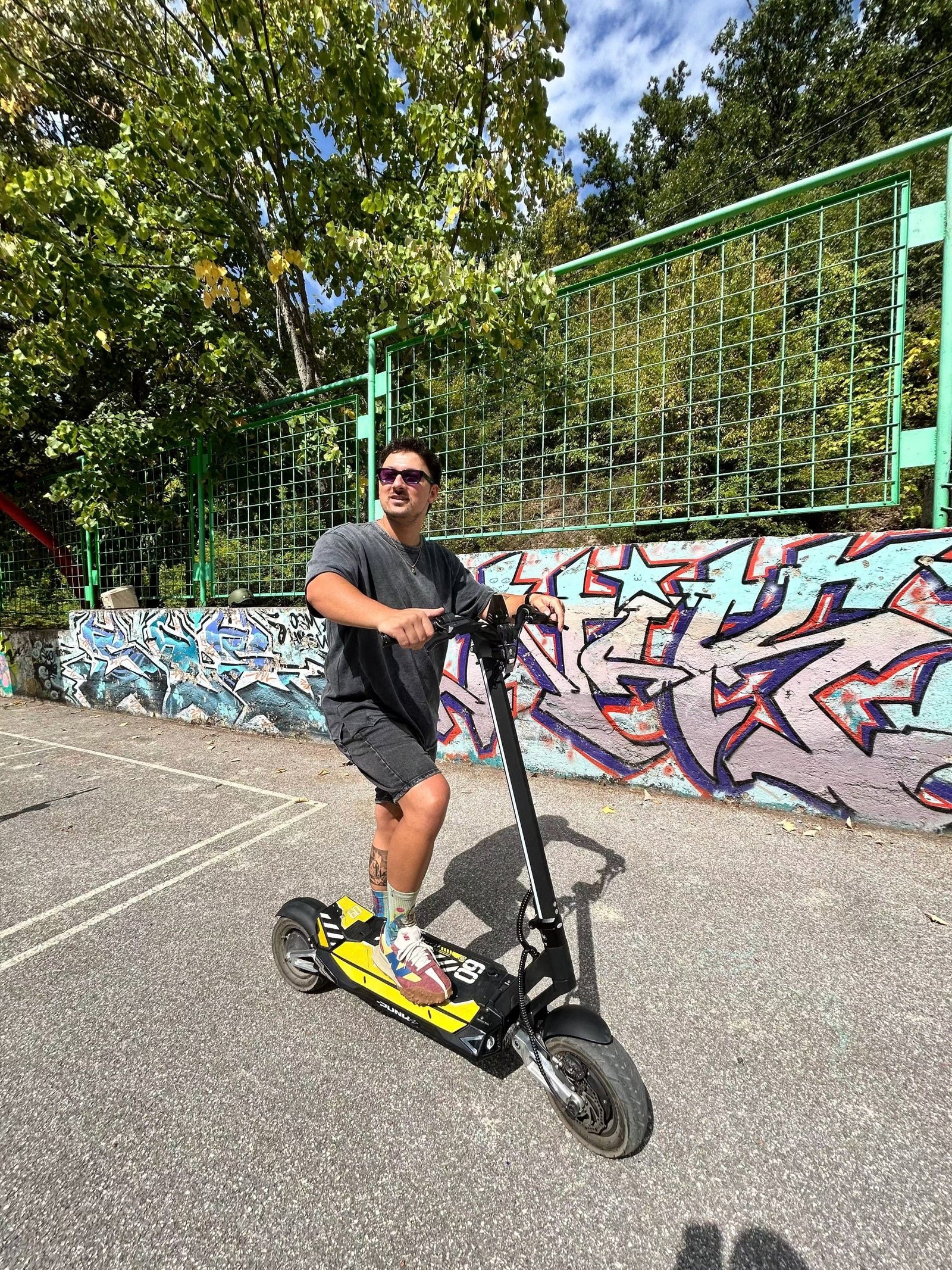 Punk Rebel electric scooter photographed outdoors from the rear