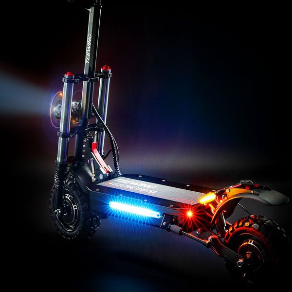 Headlight and coloured side lights on the Teewing X5 electric scooter at night