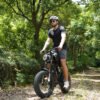 Rider on the Riding’times Z8 Pro electric bike on a forest trail