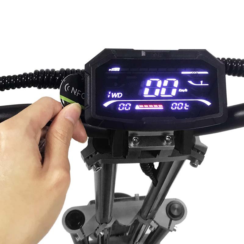 NFC card being tapped on the display of the Teewing Z4 Pro electric scooter