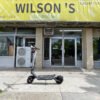 Punk Rider electric scooter parked outside a Wilson’s shop