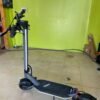 Punk Rider Pro electric scooter on the floor of a Wilson’s shop