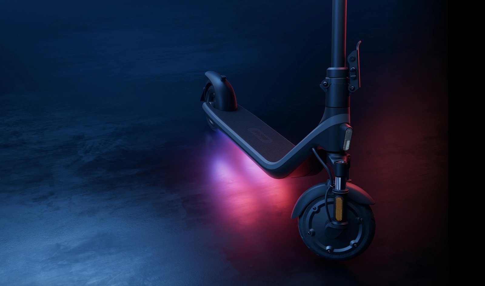 Segway E2 Plus II electric scooter with RGB ambient glow under the deck at night