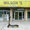 Teverun Blade Mini Ultra electric scooter outside a Wilson’s shop