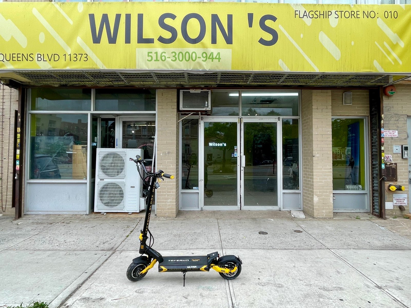 Teverun Blade Mini Ultra electric scooter outside a Wilson’s shop