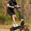 Rider on the Riding’times G63 dual motor electric scooter on a rocky trail