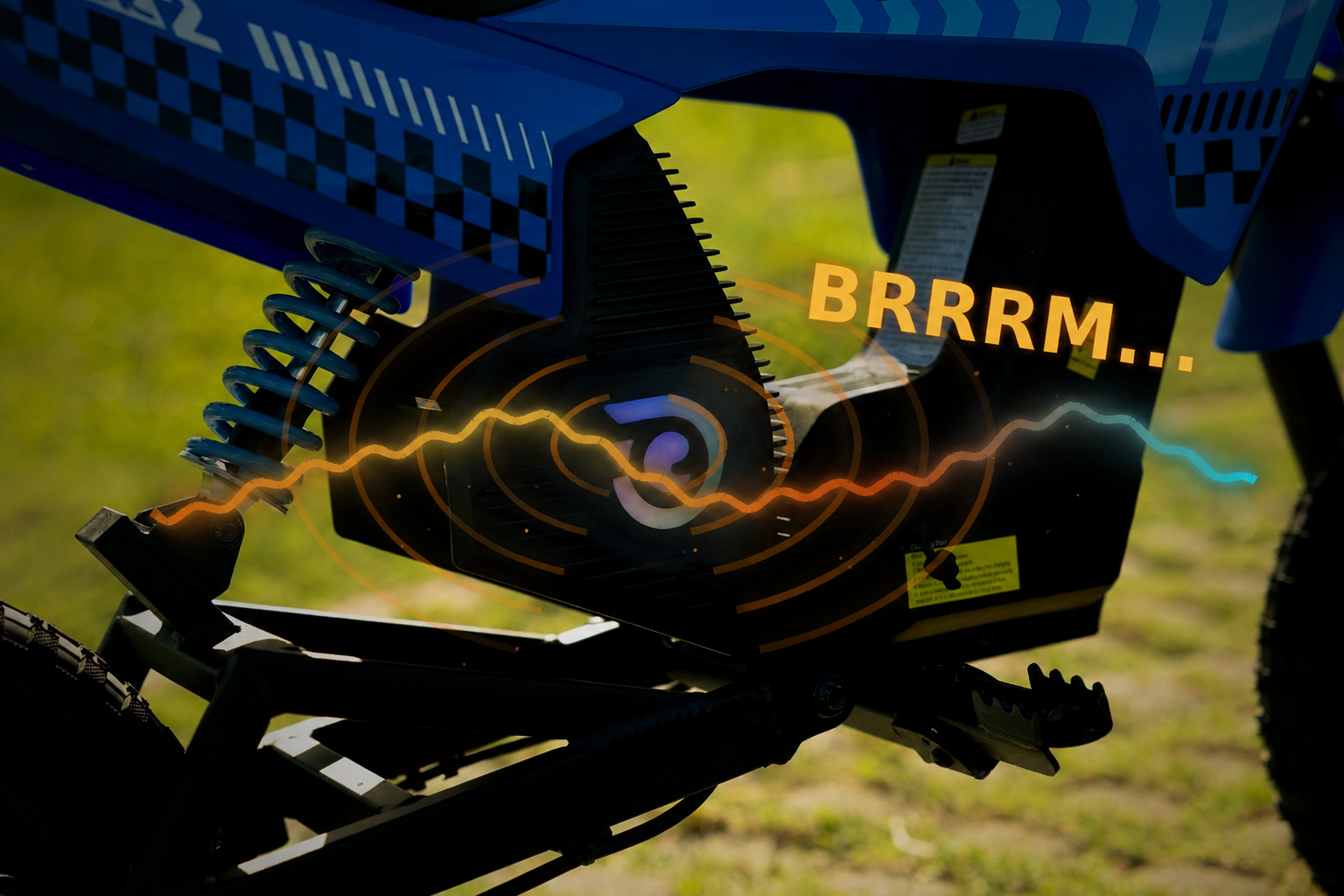 Rear shock and motor cover of the blue Hiboy DK2 kids electric dirt bike with engine sound wave graphics