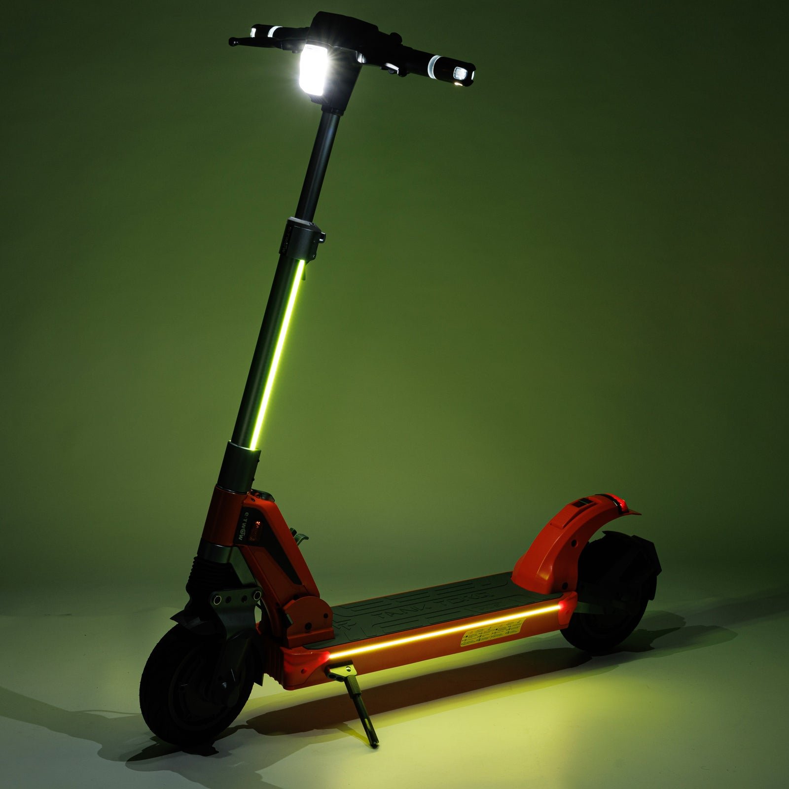 E-TWOW TankTorq TK2 with headlight, RGB taillight and side light strips lit at night