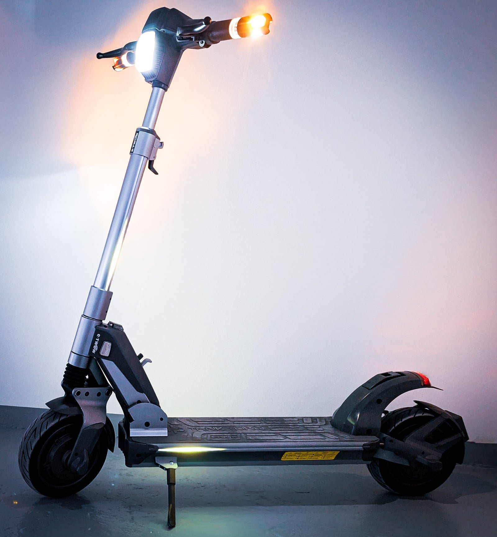 E-TWOW TankTorq TK3 headlight, RGB taillight and side strips lit at night
