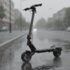 Punk Roamer electric scooter standing on a wet city street in heavy rain