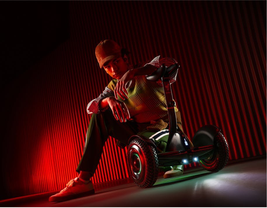 Segway Ninebot S2 with RGB wheel lights glowing in red light
