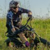 Rider on the Riding’times Z8 Pro electric bike in tall grass