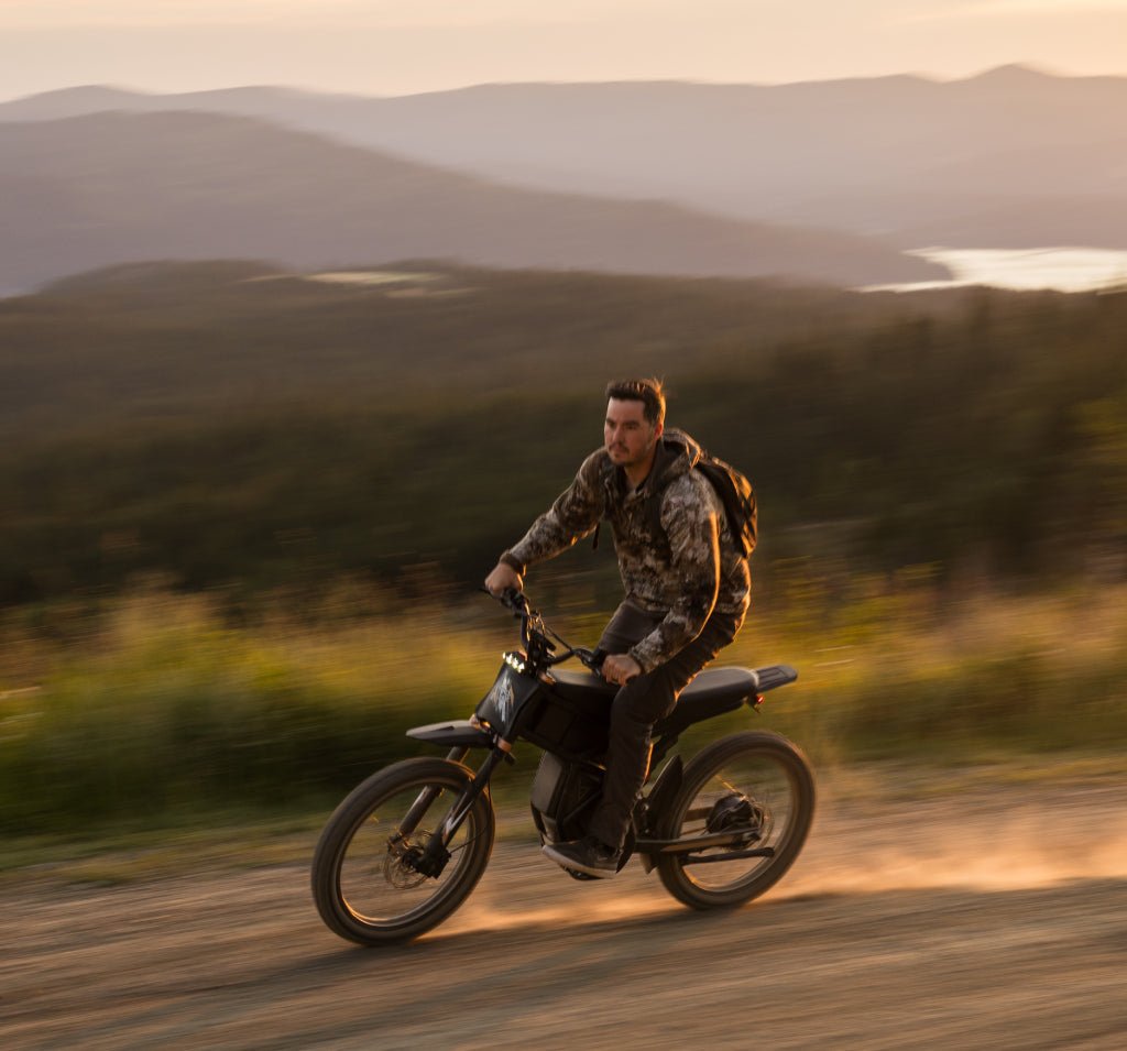 Riding’times GT73 Pro electric motorbike ridden along a ridge road at dusk