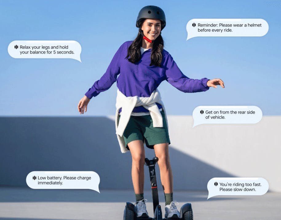 Rider learning on the Segway Ninebot S2 with voice prompts shown around her